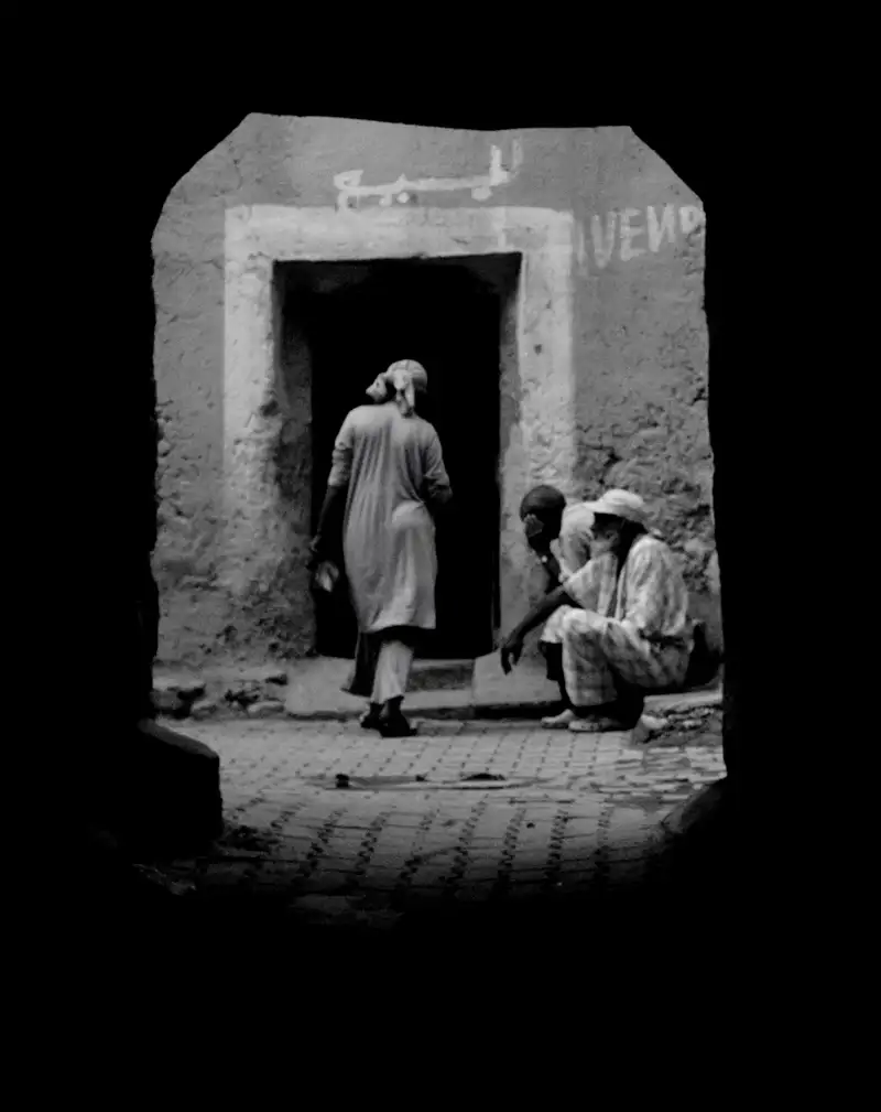 unengaged people sitting in an alley